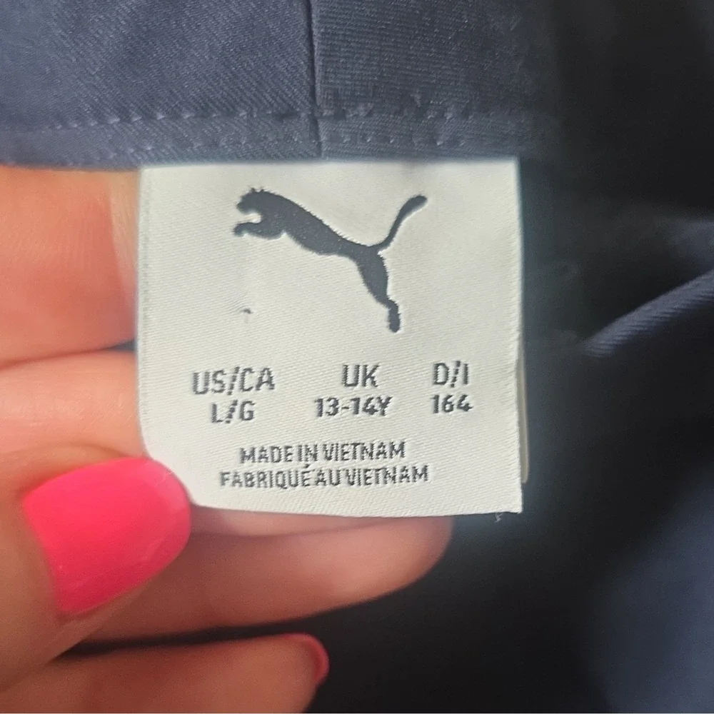 Puma youth boys navy performance shorts. Size large (13-14Y), made in Vietnam.